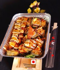 japanese food on a tray with chopsticks