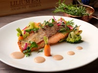 a plate with salmon and vegetables on it